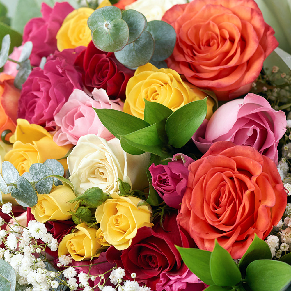 Mixed rose bouquet in red, yellow, and orange.